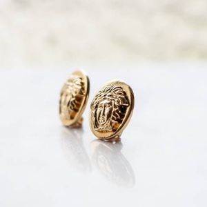Versace authentic gold medusa clip on earrings